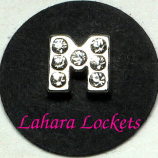This floating charm is a silver letter M with clear gems.