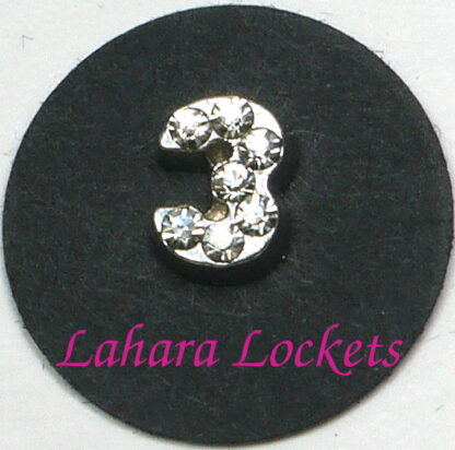 This floating charm is a silver, number three with clear gems.