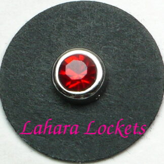 This floating charm is a red, July birthstone surrounded my silver colored metal.