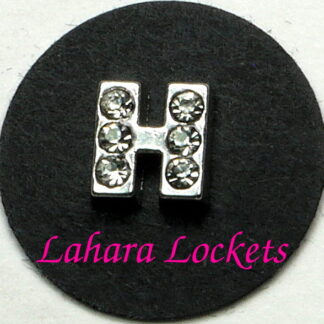 This floating charm is a silver letter H with clear gems.