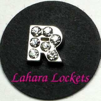 This floating charm is a silver letter R with clear gems.
